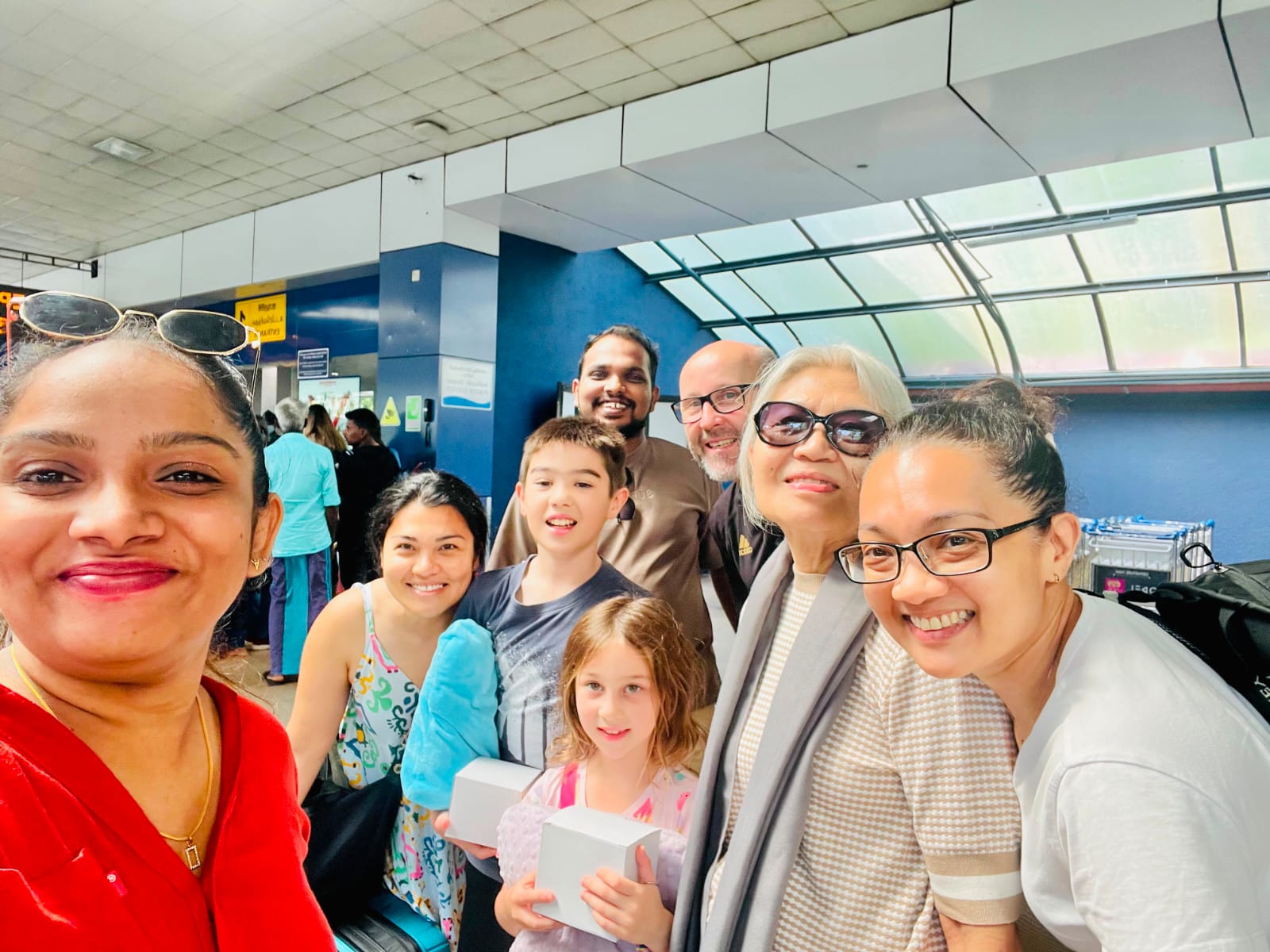 Multi-generational family welcomed at arrivals